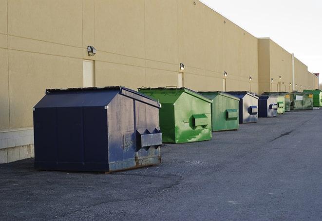 dumpsters lined up waiting to be filled with construction waste in Inez, TX